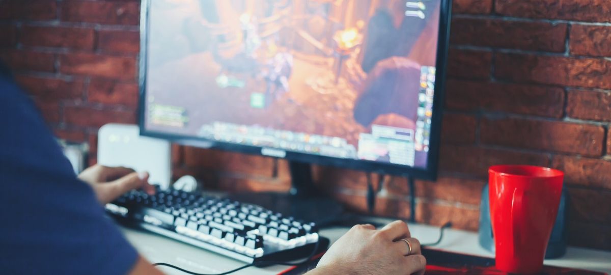 Someone playing video games on their computer in an office setting