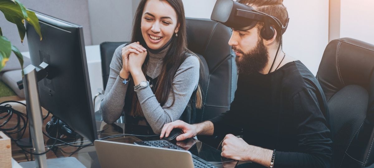 A young man and woman happily enjoying video games together