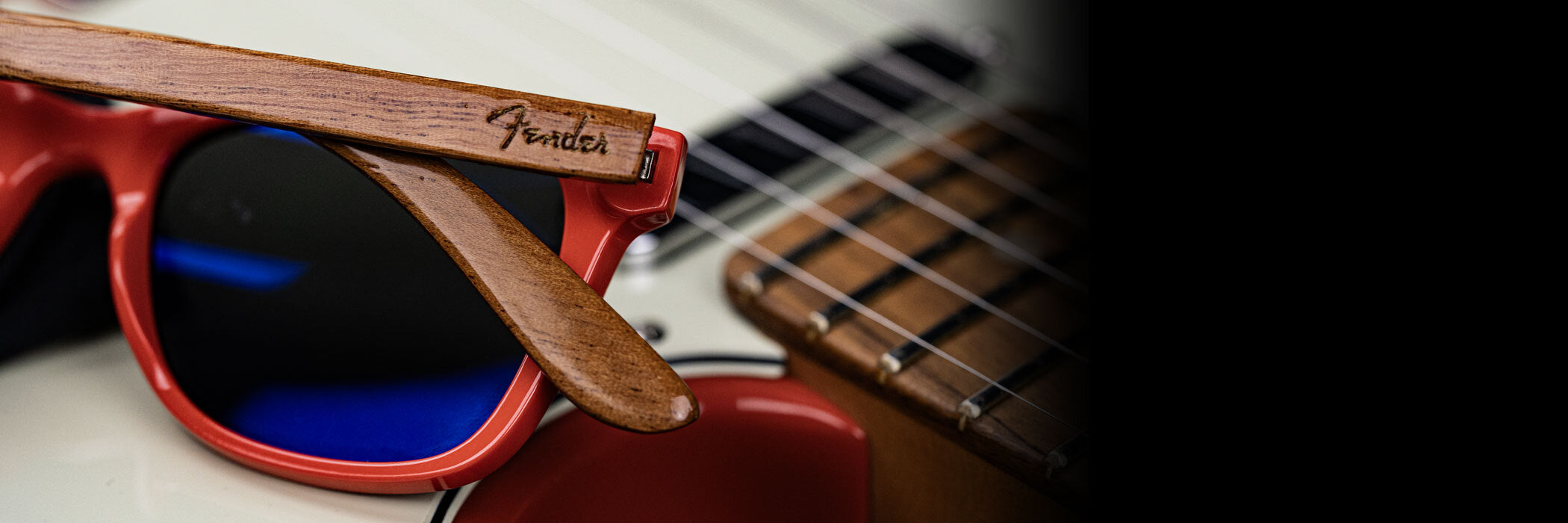 Sunglasses on a fender mini guitar case