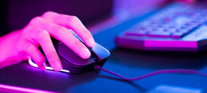 closeup of a gamers hand on a mouse in action