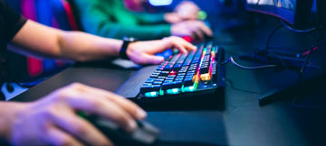 close up of someone using a keyboard and mouse